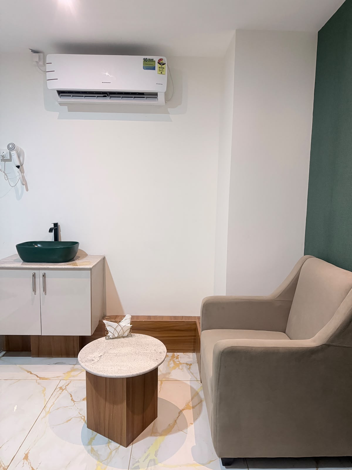 Private massage treatment suite with green accents at KEVA Luxury Spaa, Hennur