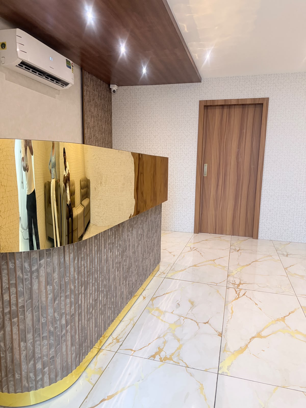 Elegant gold reception interior at KEVA Luxury Spaa, a luxury spa in Hennur, Bangalore