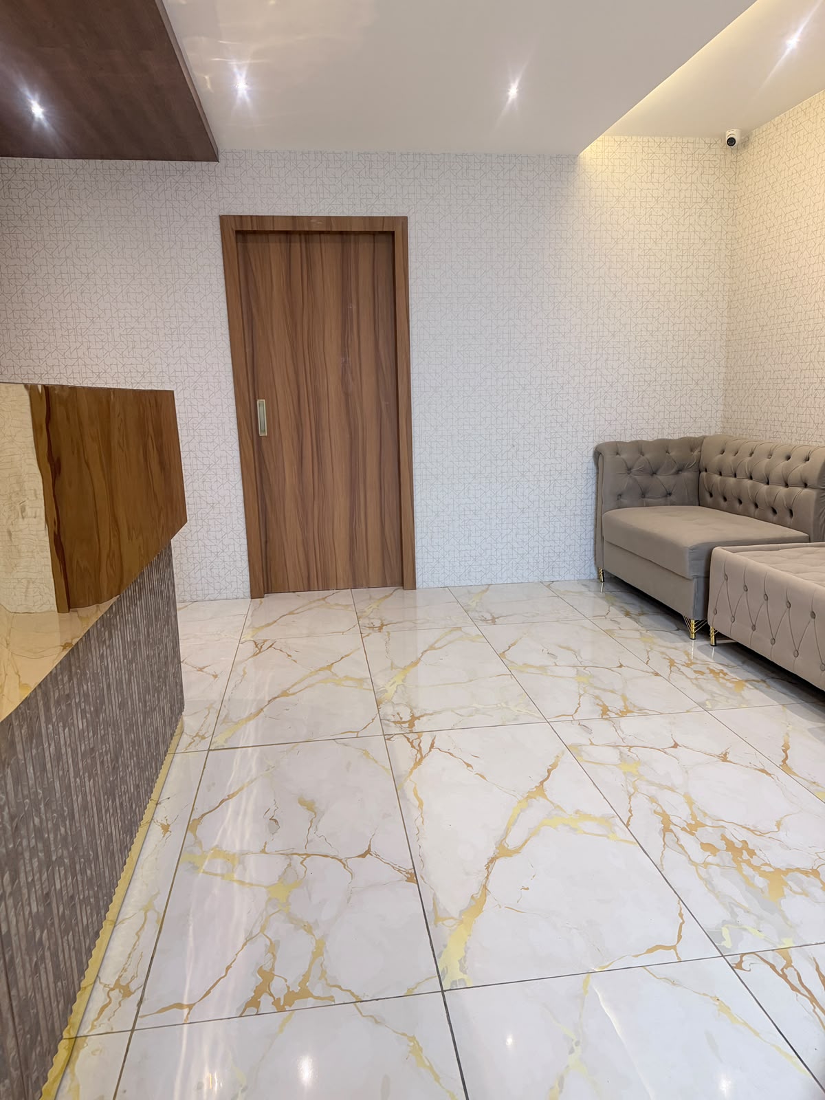 Reception and marble-floored waiting lounge at KEVA Luxury Spaa, Hennur, Bangalore