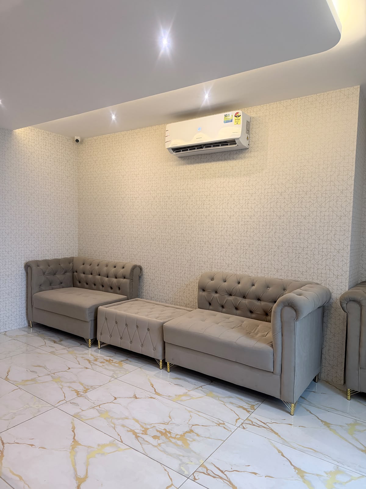 Plush tufted lounge seating in the KEVA Luxury Spaa relaxation area, Hennur